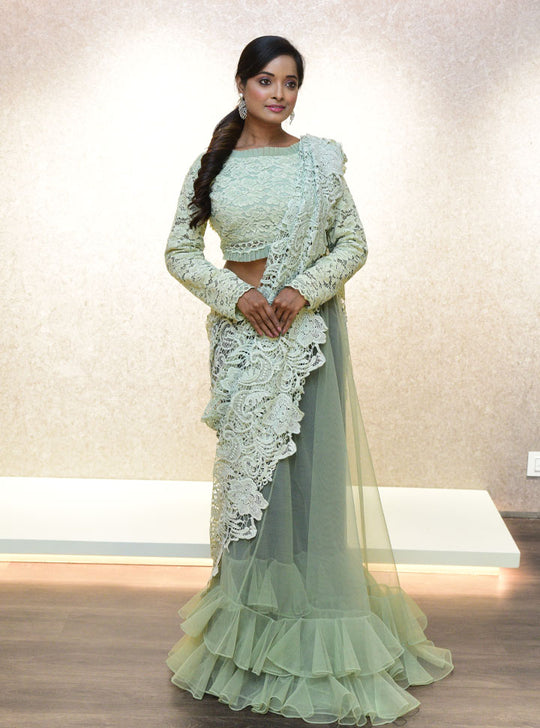 Light green ruffled bottom designer saree : Designer Collective